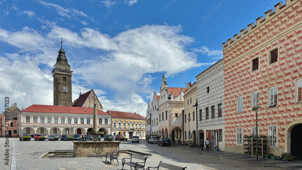Obraz premium The Peace Square with its church and fountain in the old town of Slavonice in Czechia