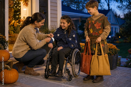Inclusive Family Preparing Safely for Trick or Treating