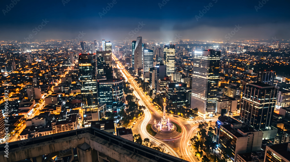 Obraz premium Mexico City skyline aerial night view with illuminated avenue and traffic light trails