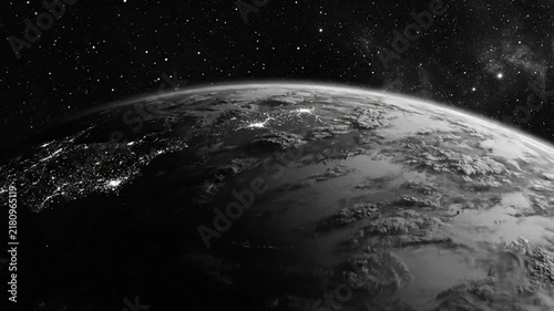 Black and white video of Earth with city lights visible from space with a starry background and transitions