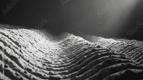 Abstract black and white macro shot of undulating textured surfaces with atmospheric lighting and depth of field