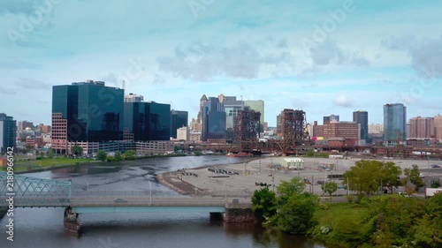 Newark New Jersey Downtown Cityscape Aerial View with River and Bridges. camera pull out over Passaic River.