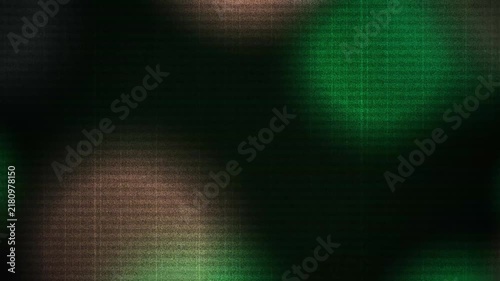 Abstract dark green and black textured background with soft glowing light leaks and grain effects