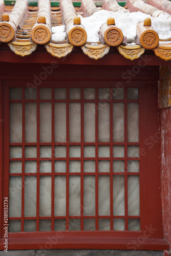 Traditional Chinese Roof Ornamentation with Snow