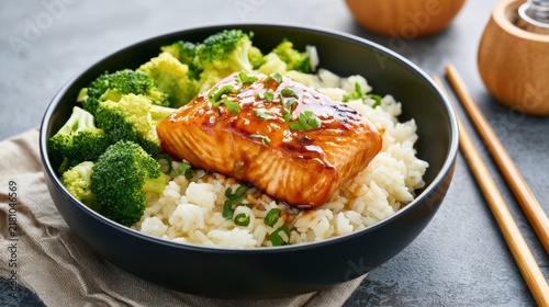 Glazed Grilled Salmon Fillet Served Over Steamed Rice and Broccoli Garnished with Green Onions