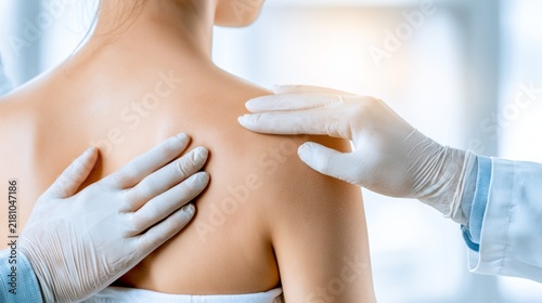 Dermatologist Providing Care to Patient with Gentle Touch while Wearing Protective Medical Gloves