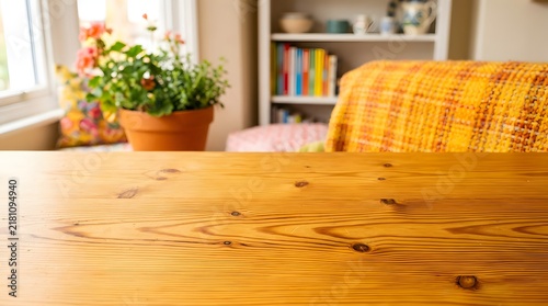 Empty wooden table in a cozy sunlit room, warm amber pine texture, rustic home interior background