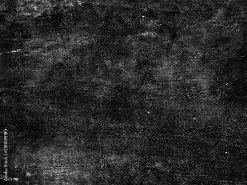 Фотография Grungy black surface with numerous white scratches and dust particles, creating a distressed and textured overlay for abstract or vintage designs