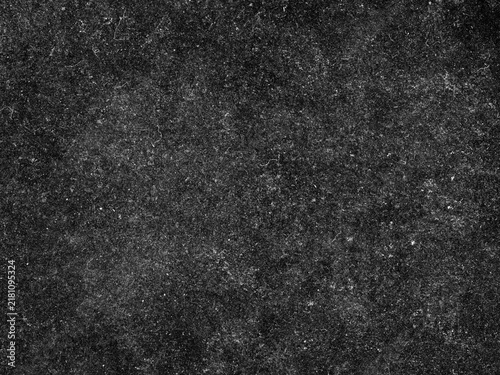 Grungy black surface with numerous white scratches and dust particles, creating a distressed and textured overlay for abstract or vintage designs.