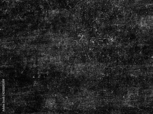 Grungy black surface with numerous white scratches and dust particles, creating a distressed and textured overlay for abstract or vintage designs.
