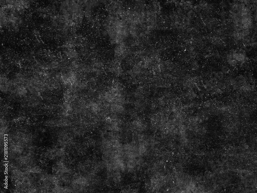 фотографія Grungy black surface with numerous white scratches and dust particles, creating a distressed and textured overlay for abstract or vintage designs