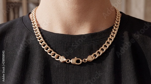 Person Wearing Stylish Gold Cuban Link Chain Necklace Elegant Jewelry Accessory on Neck