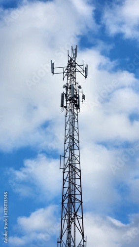 Fotografía Cell tower against blue sky, telecommunications mast for wireless network signal coverage