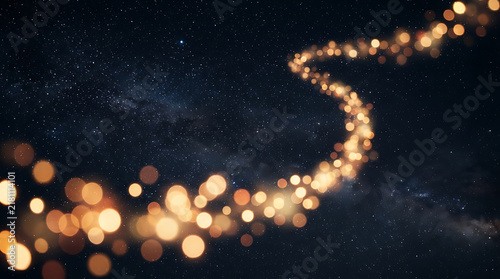 Golden fireworks exploding in night sky