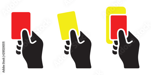 Red and yellow penalty cards held in hand isolated for sports referee warning and sending off action.