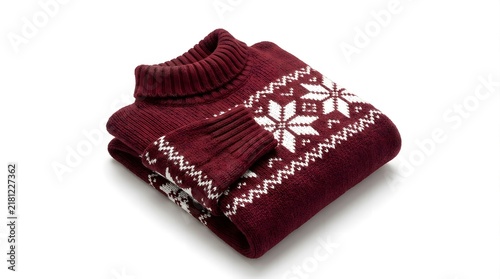 Folded burgundy christmas sweater with white snowflake pattern isolated on white background