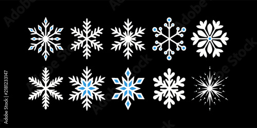 Set of ten unique decorative snowflake shapes with blue details arranged on a dark surface