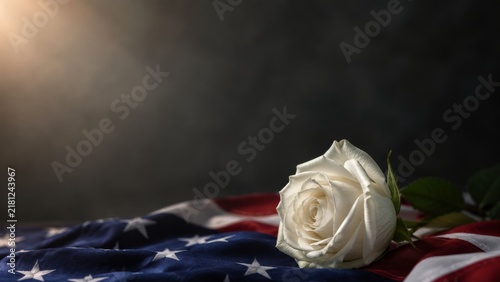 White rose on American flag for September 11 memorial