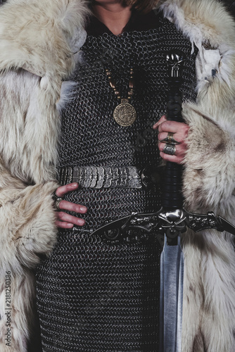 Obraz na płótnie Chainmailed Warrior With Sword in a Fur Coat, Mystical Concept