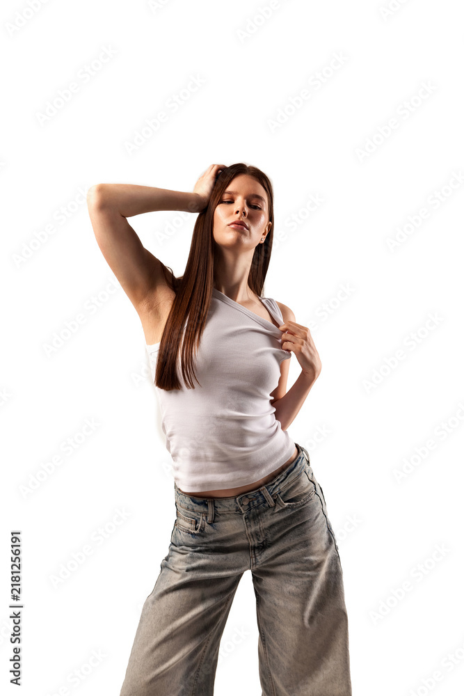 Fototapeta premium Young Female Model Showcases Clothing in Outdoor Setting for Catalog