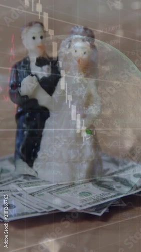 Animation of data processing over wedding figurines and banknotes