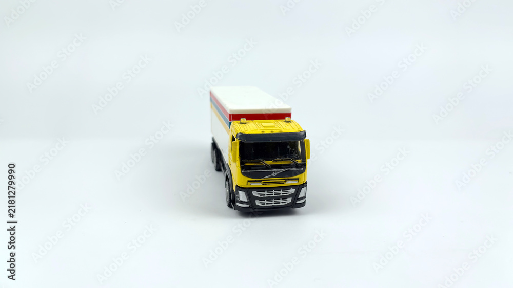 Fototapeta premium Kediri, East Java, Indonesia – September 4, 2026: LEGO Toy Truck Model with Colorful Cargo Box Displayed on White Background