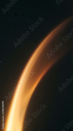 A glowing crescent edge of a planet or celestial body (resembling Titan or Venus atmospheric limb).