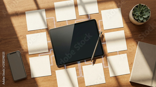Digital tablet on wooden desk surrounded by blank adhesive note papers for creative planning with adhesive notes planning board sticky notes office desk