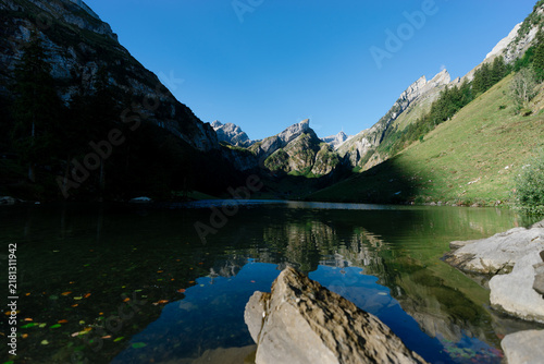 Картината върху платно Serene view of Seealpsee lake reflecting the majestic peaks of the Alpstein mass