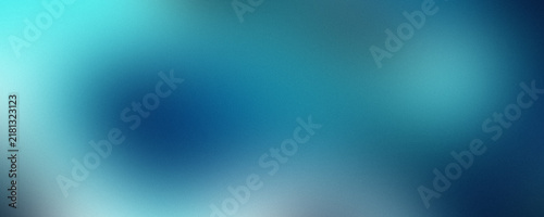 Abstract cyan and deep blue gradient background with soft light glow and grainy noise texture.