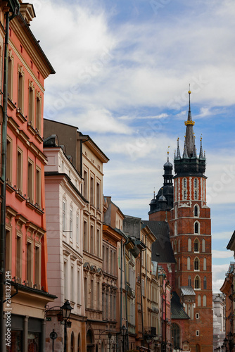 Obraz na plátně Aged European gothic architecture lines a beautiful street with a prominent chur