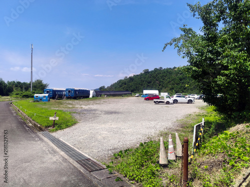 Bild auf Leinwand Blue Train Sleeper Car Lodging and Paved Pathway Landscape near Unpenji (the 66t