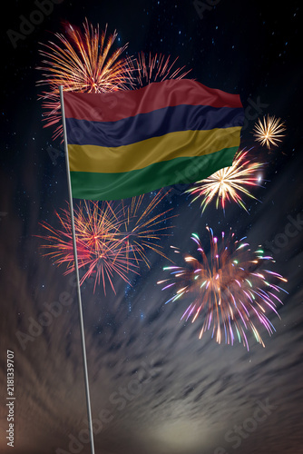 Waving National flag of Mauritius and holiday fireworks in night sky