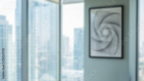 Blurred modern office interior background with big windows and city view, defocus abstract space for mockup