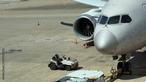 Commercial Passenger Jet Nose and Engine on Airport Tarmac