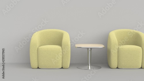Two boucle armchairs and a modern coffee table indoors