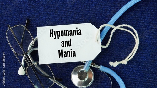 Bild auf Leinwand Stethoscope, glasses and paper tags with the words Hypomania and mania