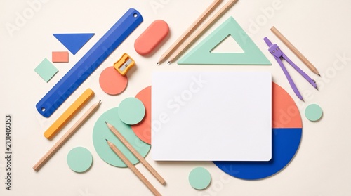 Top view of school supplies and colorful geometric shapes with central copy space