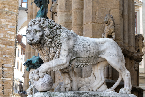 Medici Lion holds the globe in Piazza della Signoria. Marble Renaissance lion statue at the entrance of Loggia dei Lanzi in Florence