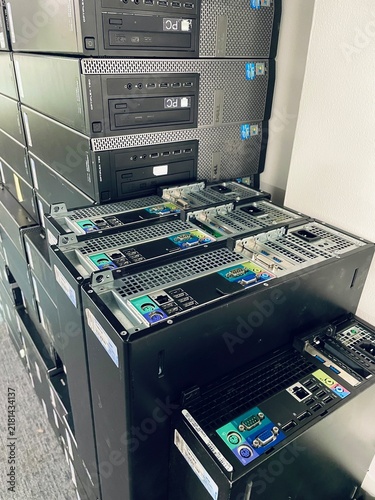 Stack of Dell Optiplex desktop computers ready for deployment or recycling