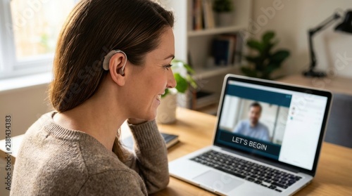 Hearing impaired woman reading subtitles on laptop during video conference