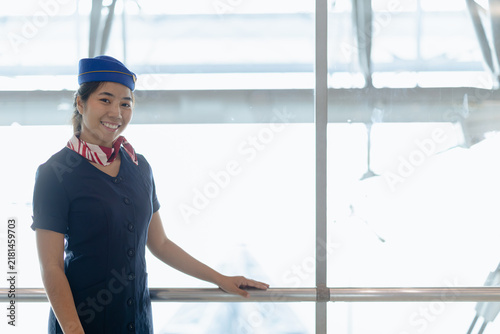 Airport ground service person, Asian beauty woman airline uniform standing happy smiling in airport