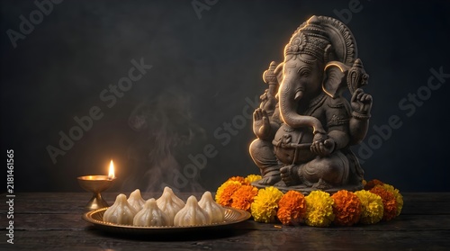 Divine Bronze Ganesha Statue with Modak Sweets, Marigold Flowers, and Lit Diya on a Wooden Table for Hindu Pooja and Festivals