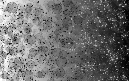 Abstract splattered background with chaotic circles and black and white droplets on a white to black gradient.