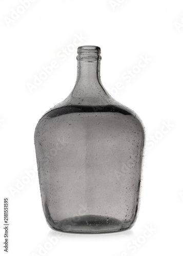 Foto Empty vintage large grey glass bottle carboy isolated on white background with texture and small air bubbles inside