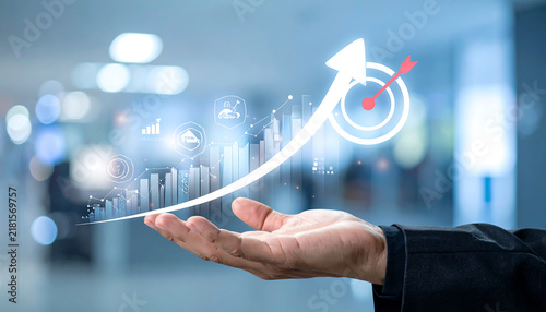 Hand holding growth business strategy arrow concept on success target improvement with increase development graph profit or economy investment income target and goal increase achievement.