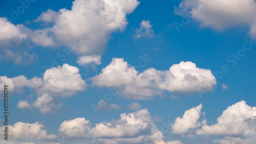 Blue Sky with Fluffy Cumulus Clouds Background in 16x9 Panoramic Format