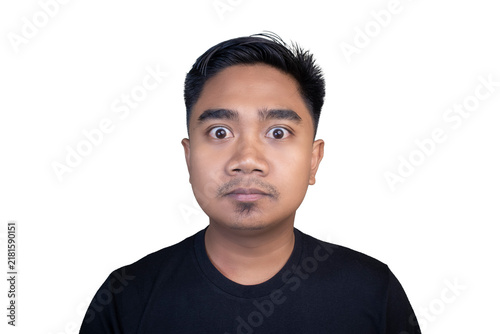 Man stares with wide eyes, expression of surprise. He wears a plain black t-shirt. Simple white background highlights his face. Perfect for humor, reaction, or surprise themes