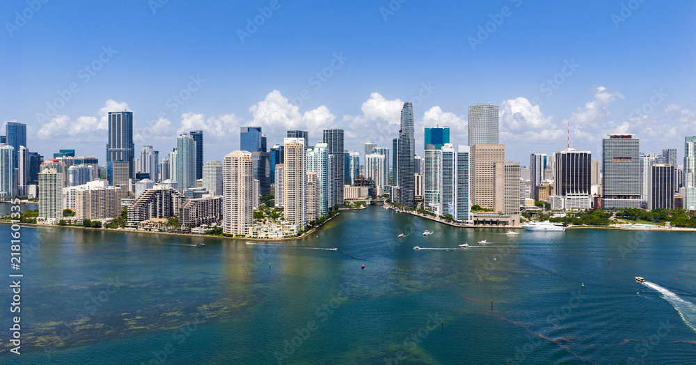 Obraz premium Miami Brickell skyline with skyscrapers and coastline. Miami aerial cityscape with skyline. Miami coastal skyline with oceanfront. Miami business district skyline view.