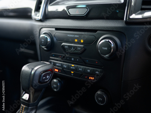 Focus on car's gear shifter and control panel